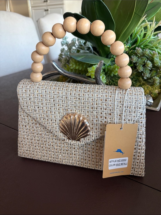 Tommy Bahama Handbags - NWT Tommy Bahama Gold& Silver Woven design with Shell Accent Handbag